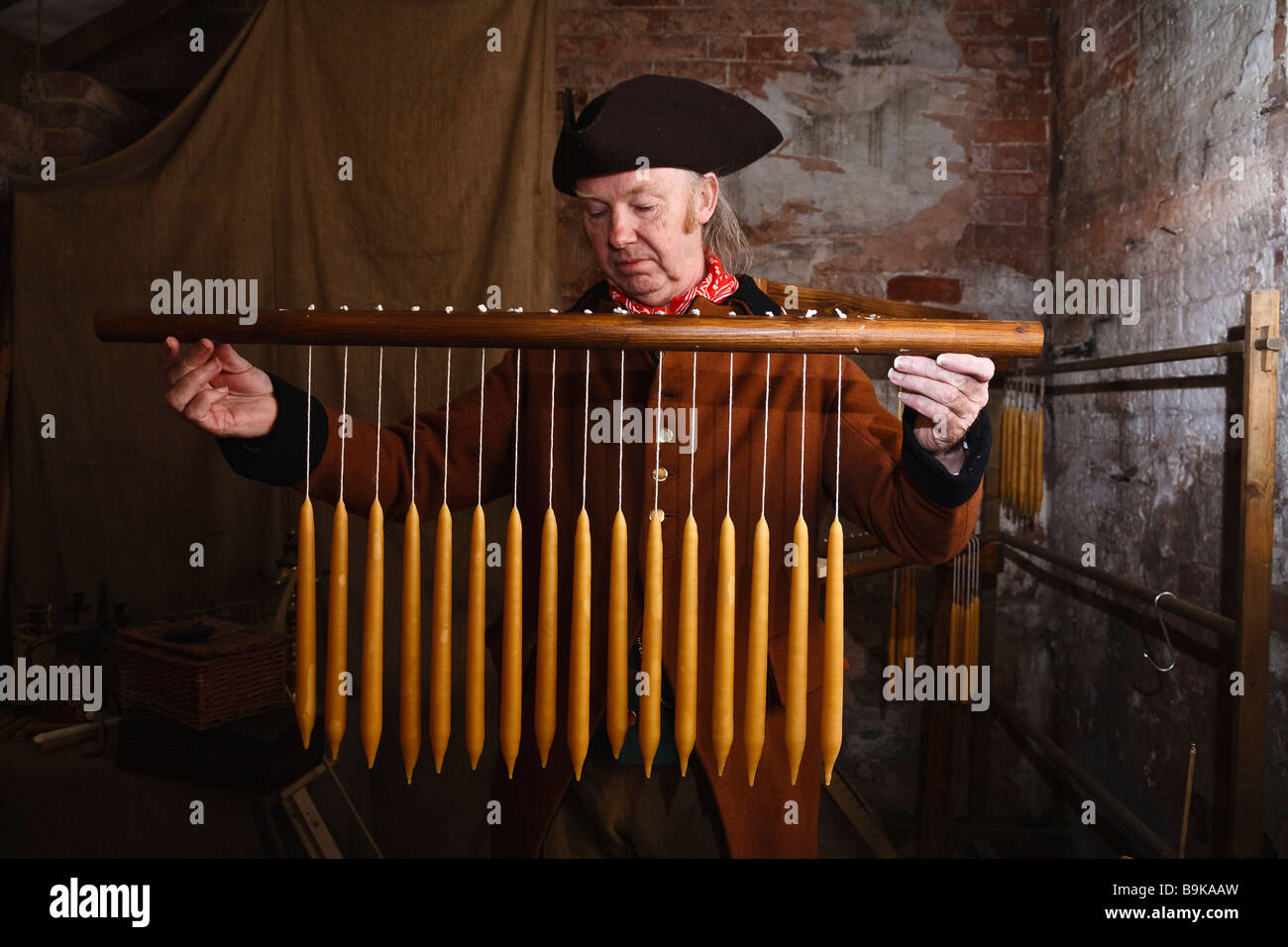 Candle maker Roy Figgis making beeswax candles at Shugborough historic