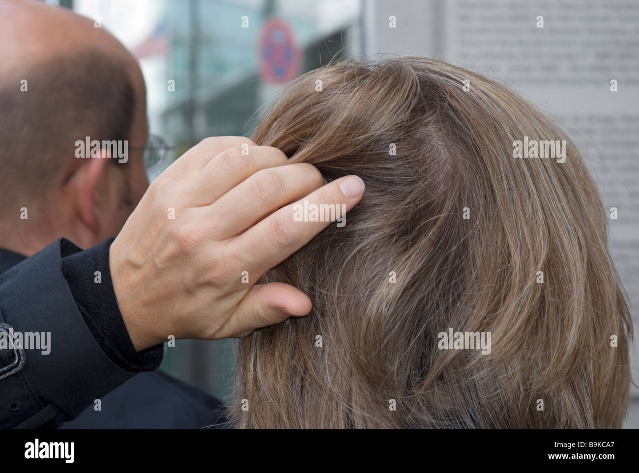 woman touching her head Stock Photo