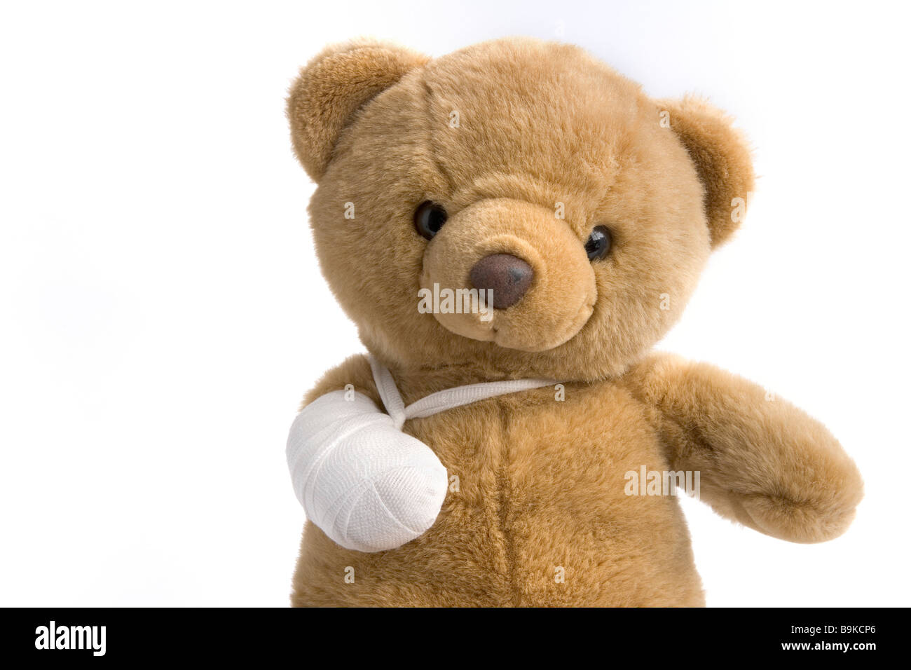 Toy bear with a broken leg Stock Photo
