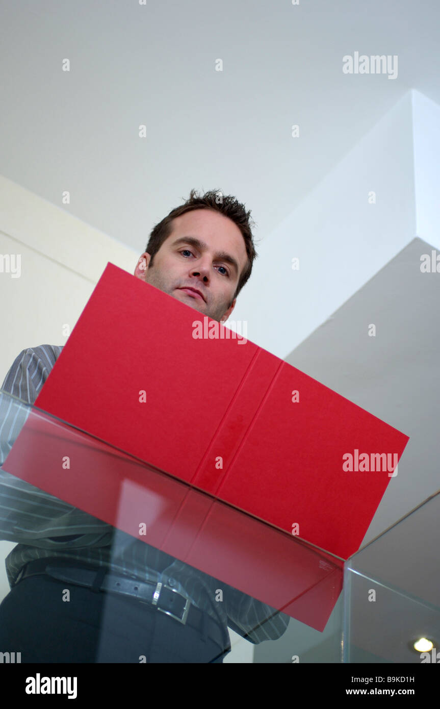 portrait of executive with red folder Stock Photo Alamy