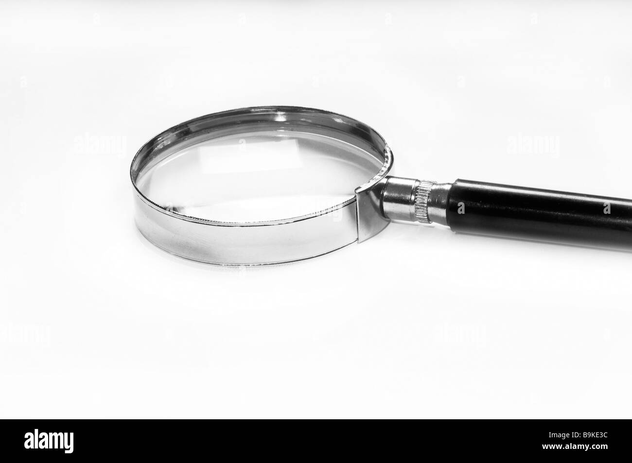 Magnifying glass examining Black and White Stock Photos & Images Alamy