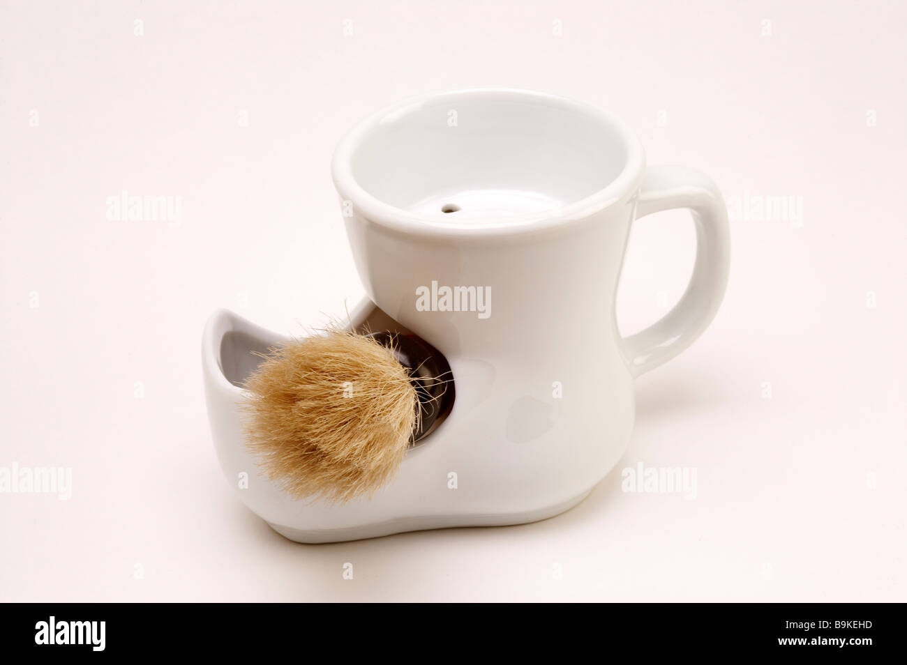 White shaving mug and brush Stock Photo Alamy