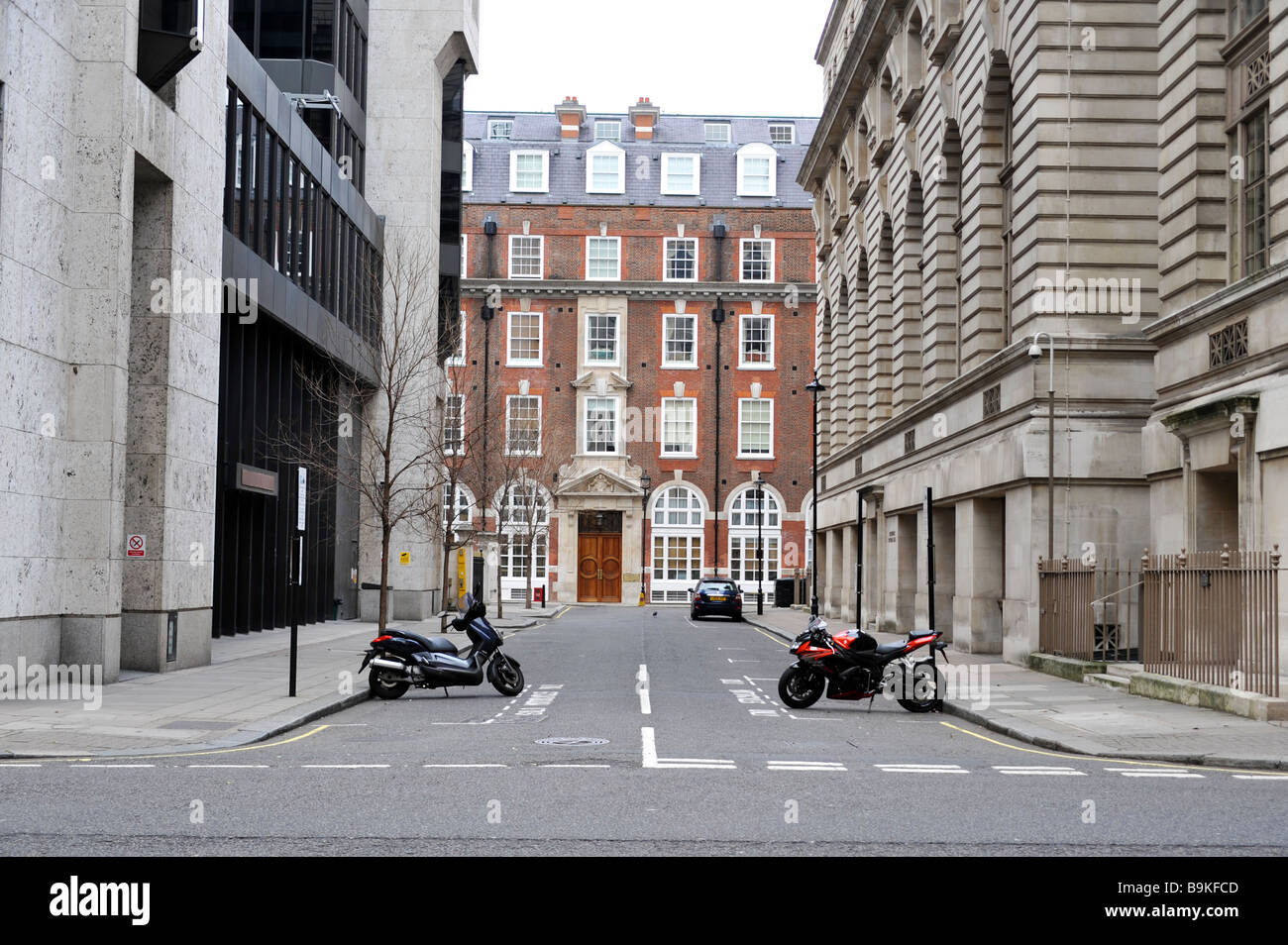 Two Parked Motor Cycles on a London, England Street Stock Photo