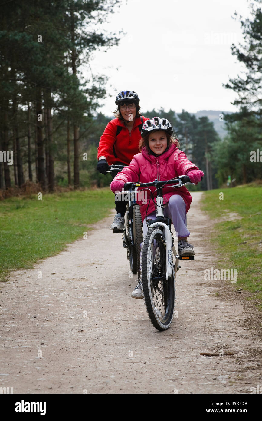 Mother and daughter cycling at Birches Valley, Cannock Chase Stock Photo