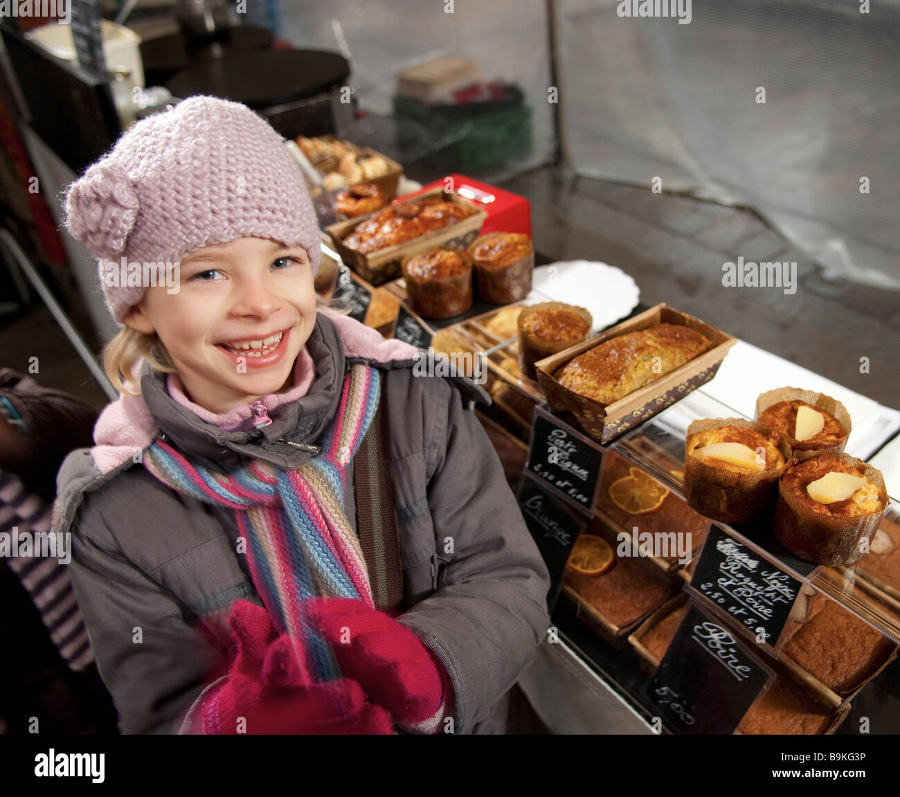 Girl at bakery stall at market Stock Photo Alamy