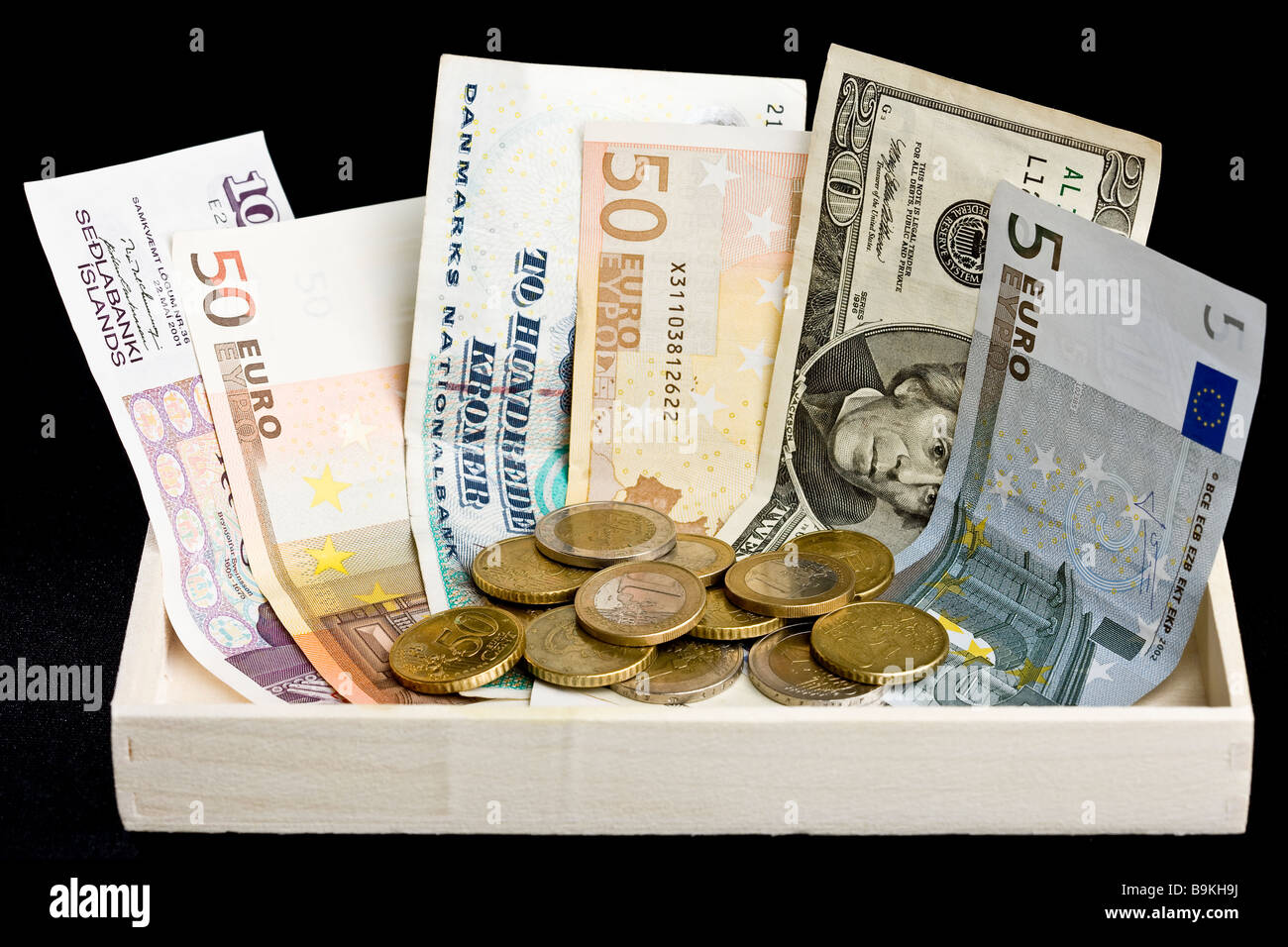 Wooden collection box with various currency Stock Photo Alamy