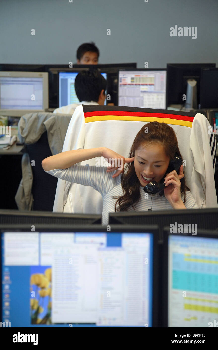 Chinese Oil Derivatives Broker dealing by telephone, Singapore, Asia Stock  Photo - Alamy