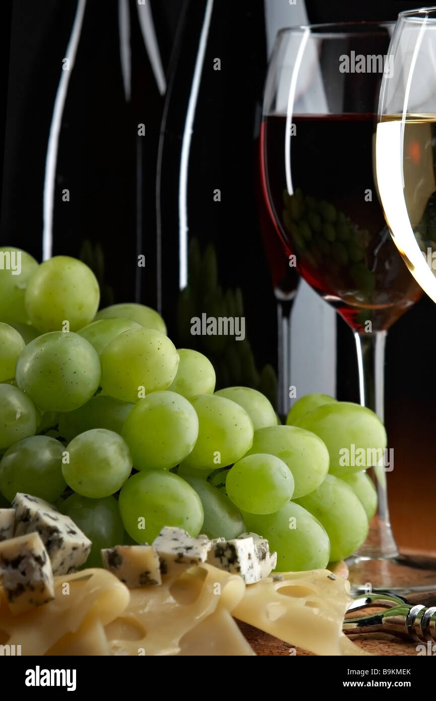 still life with grape cheese and wine on the black background Stock Photo