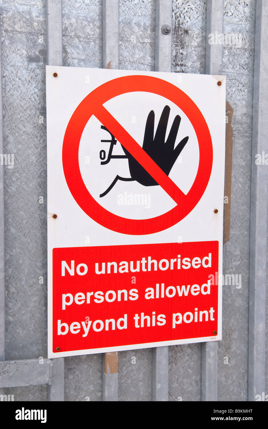 A no unauthorised persons allowed beyond this point sign Stock Photo ...