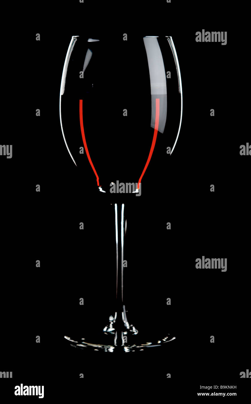 glass with red wines on the black background Stock Photo