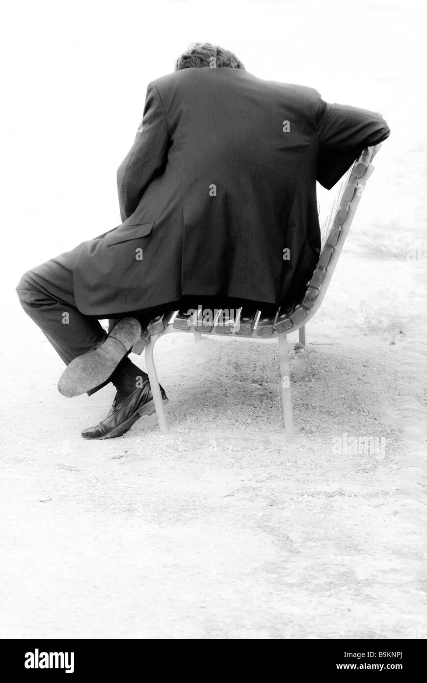 Man sitting on a bench Stock Photo