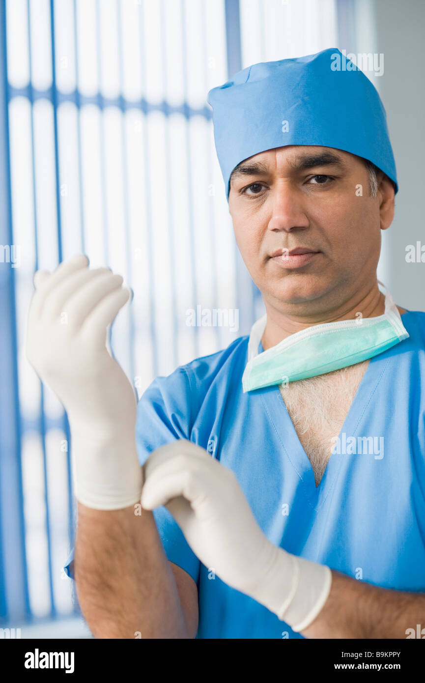 Portrait of a surgeon wearing surgical gloves Stock Photo Alamy