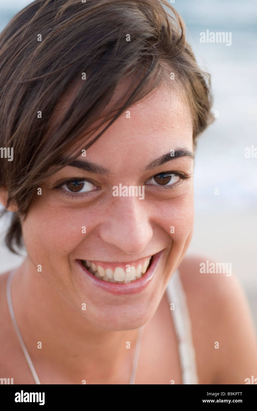portrait of brown girl smiling at camera Stock Photo - Alamy