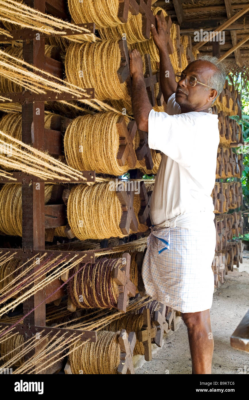 India, Kerala, weaving withcoco fibre balls Stock Photo