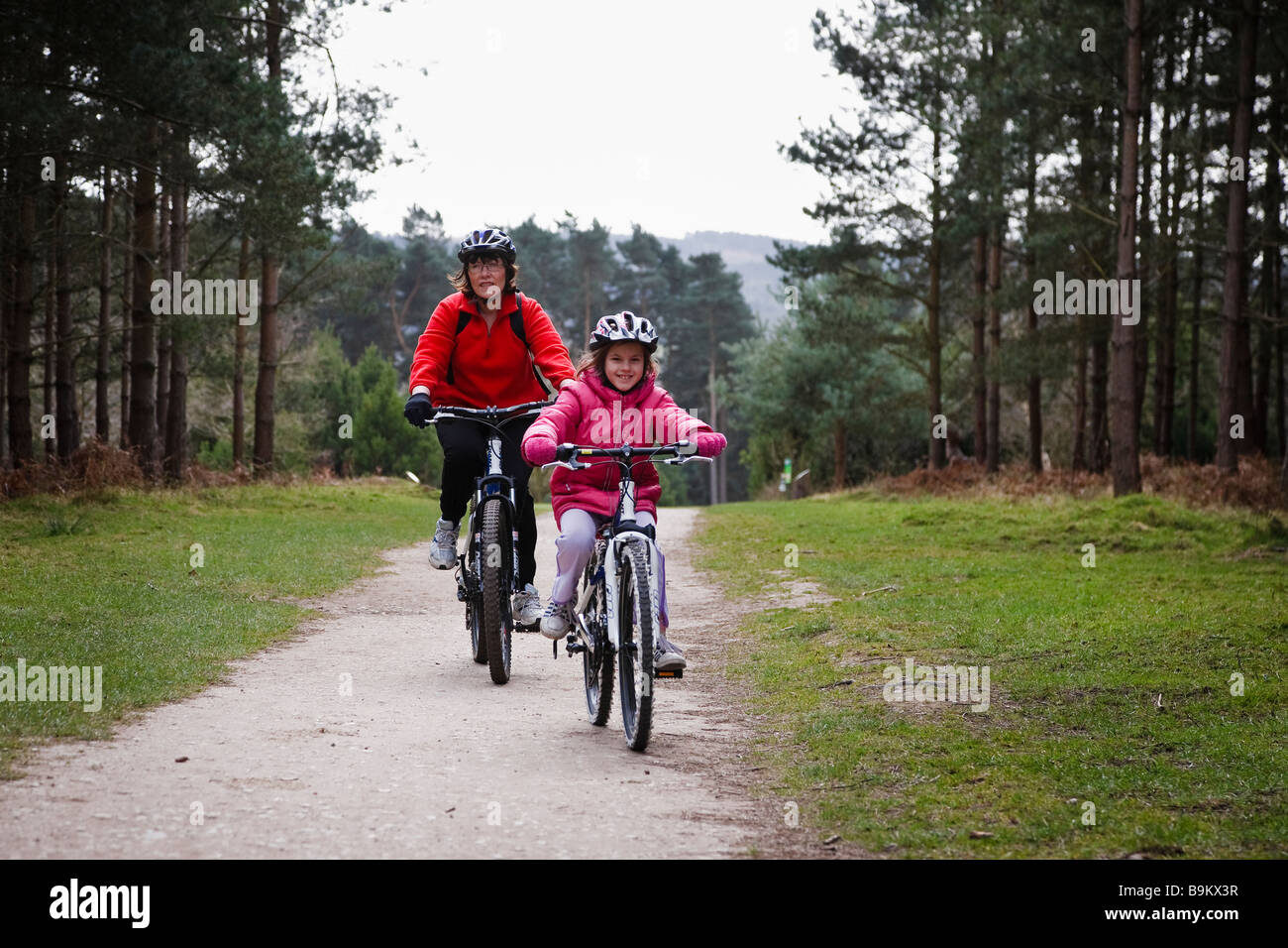 Mother and daughter cycling at Birches Valley, Cannock Chase Stock Photo