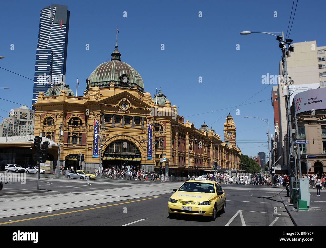 Historical Victorian train station Flinders Street station and Eureka Tower in the background in Melbourne,Australia. Stock Photo