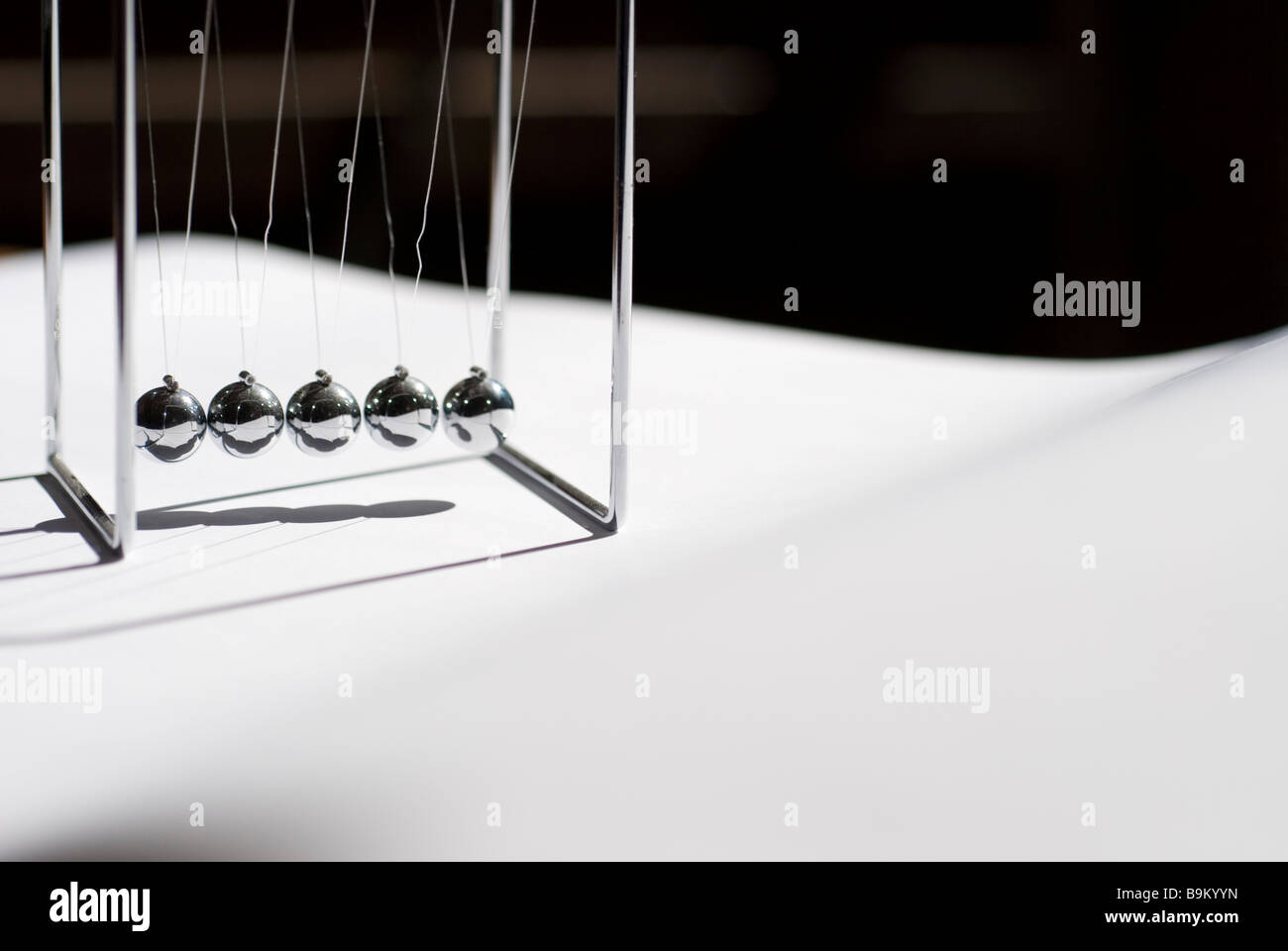 Newtons cradle Stock Photo