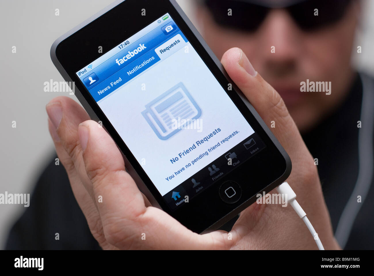 iPod Touch that displays the No Friend Requests screen of the Facebook Social Networking Application Stock Photo