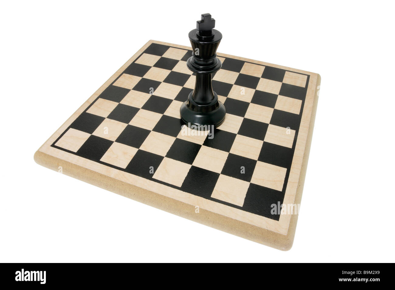 King Chess Piece on Chess Board Stock Photo