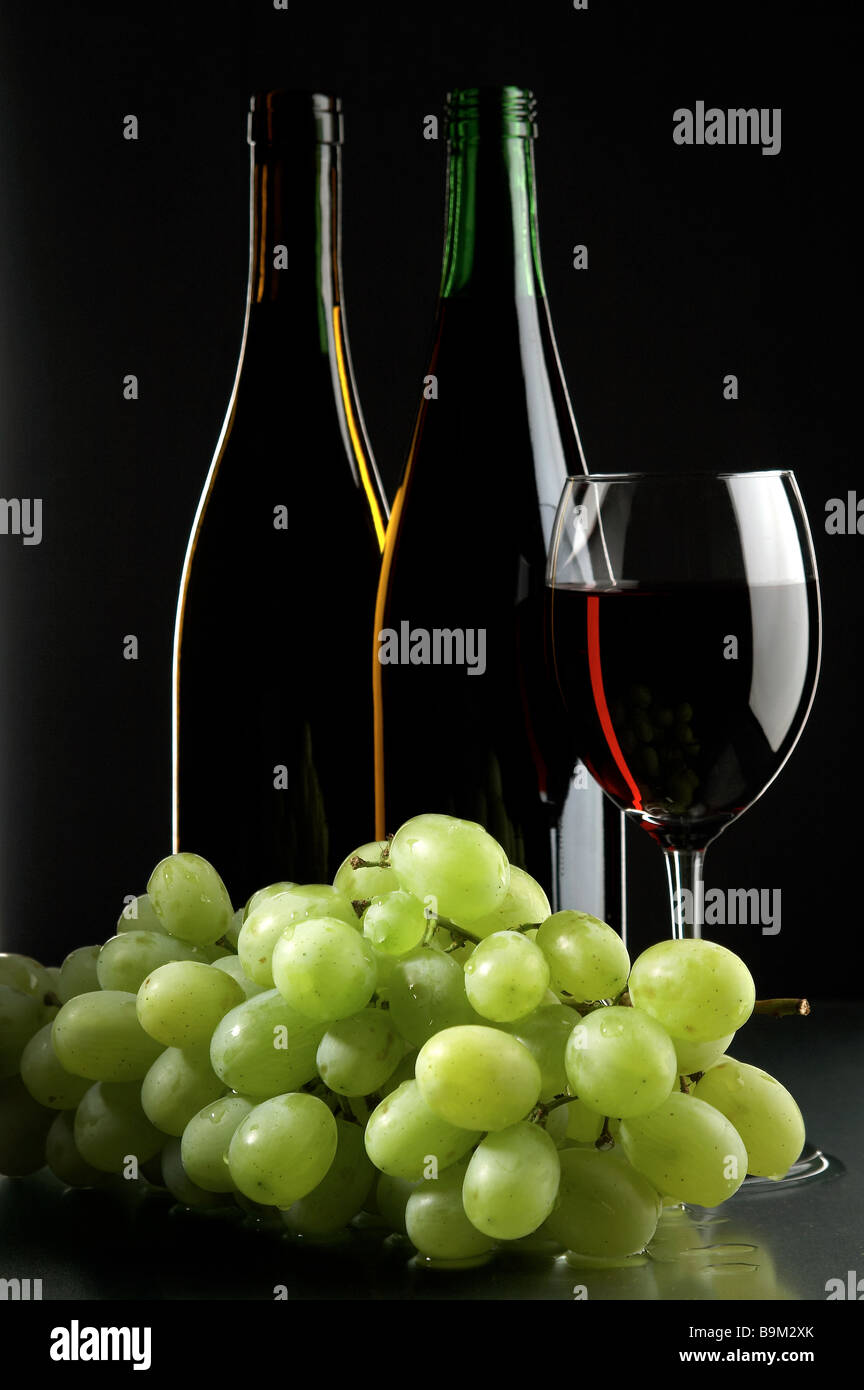 still life with grape and wines on the black background Stock Photo