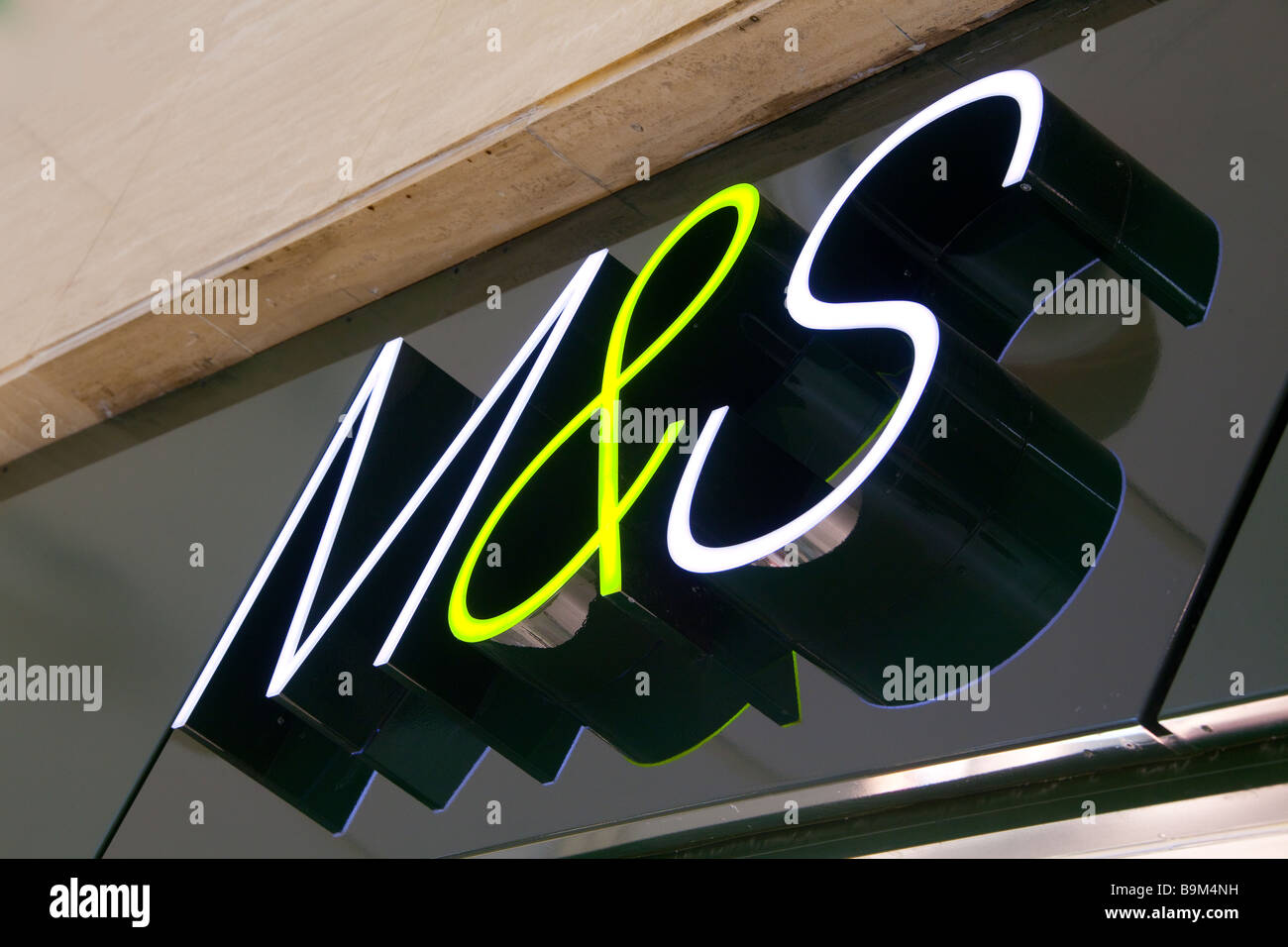 Marks and Spencer company logo of initials M&S on the front of the shop building Stock Photo