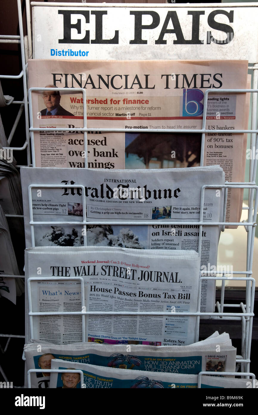 International newspapers on sale at a newsstand in London UK Stock Photo