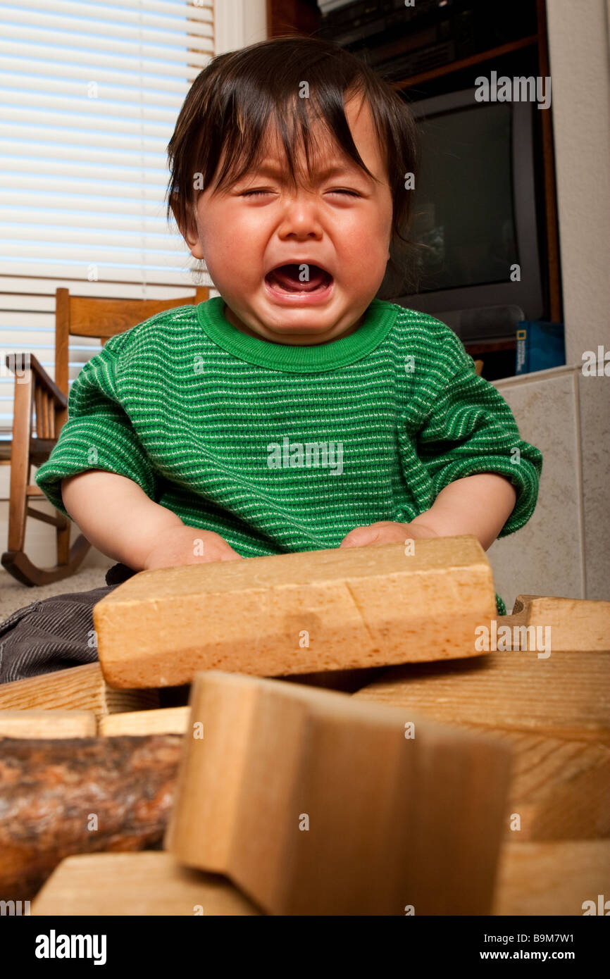 A ten month old baby playing with blocks Stock Photo Alamy