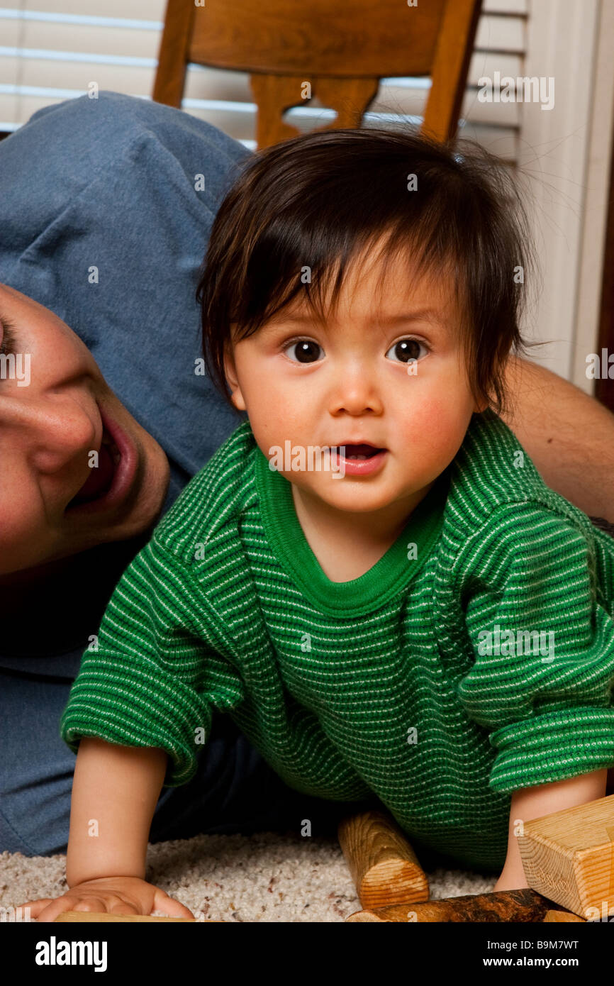 A ten month old baby playing with his dad Stock Photo Alamy