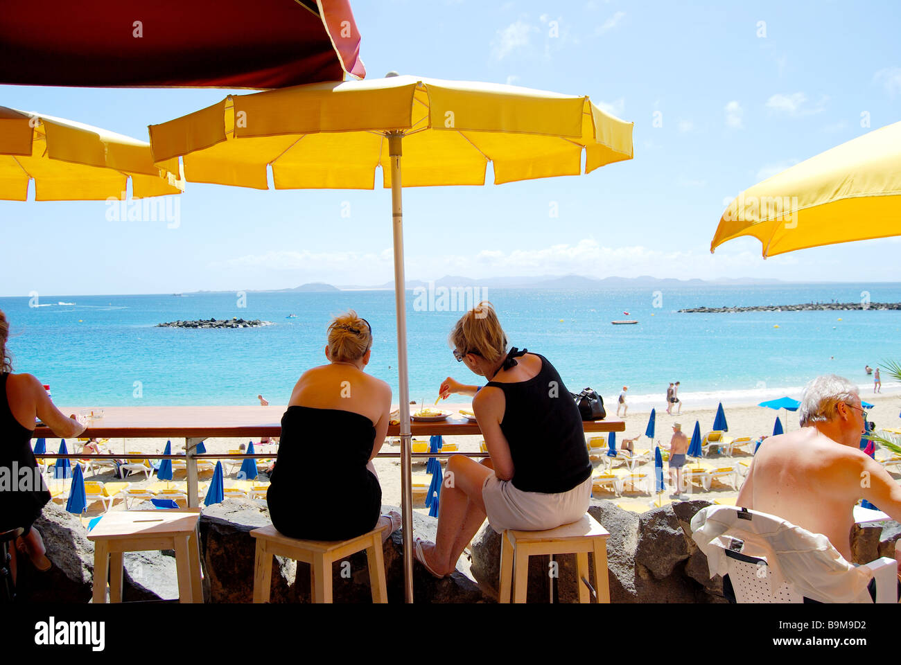 Beach promenade cafe, Playa Grande, Playa Blanca, Lanzarote, Canary Islands, Spain Stock Photo
