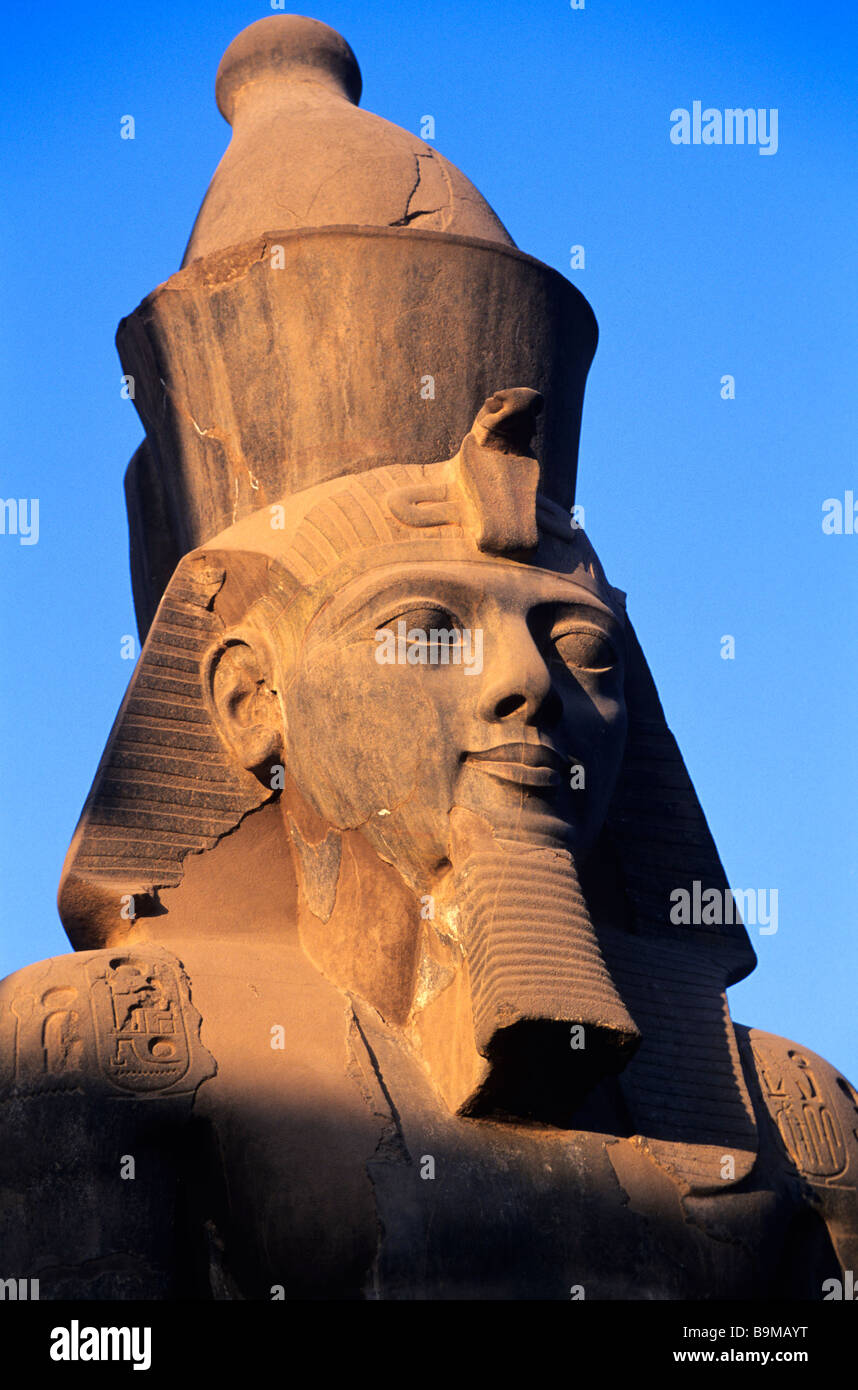 Egypt, Nile Valley, Luxor, detail of Ramses II's head at Luxor Temple in front of the entrance of the 2nd pylon Stock Photo