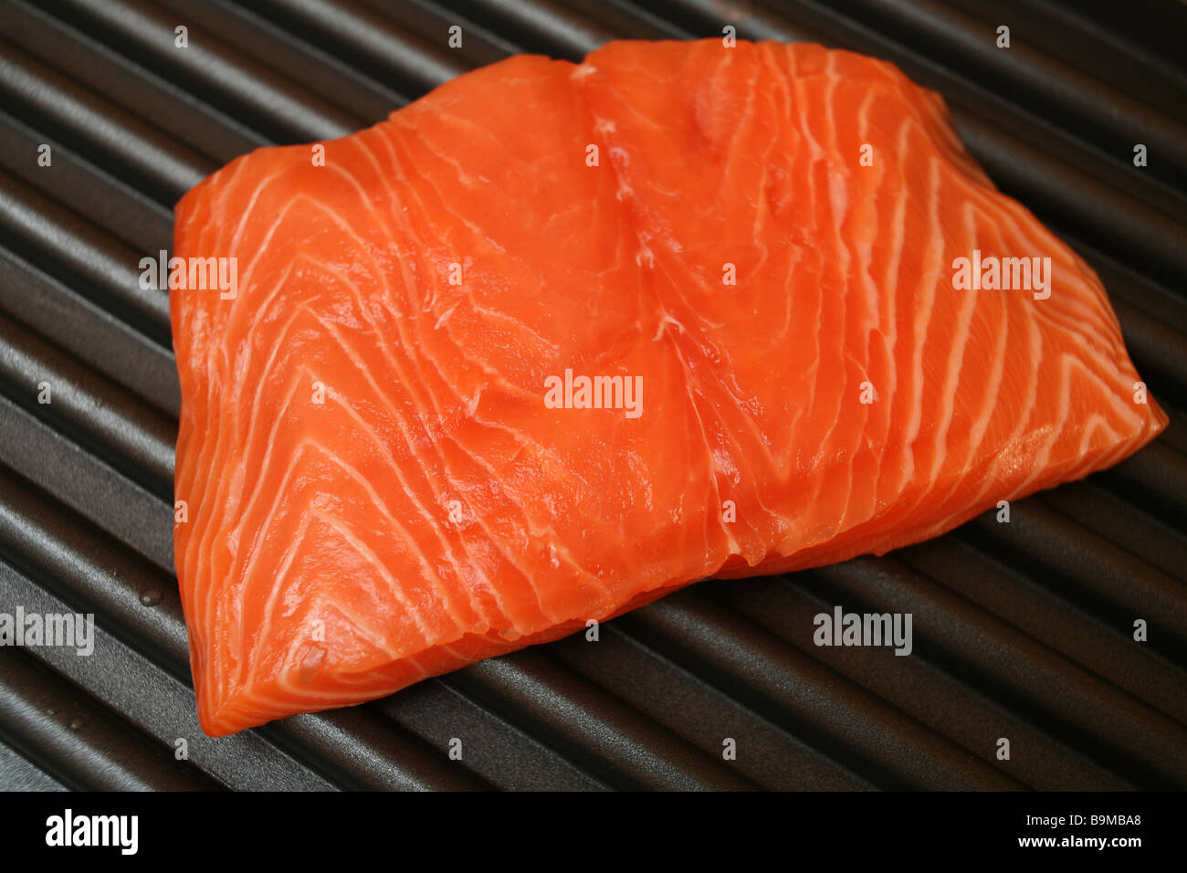 A salmon steak on an electric grill Stock Photo Alamy