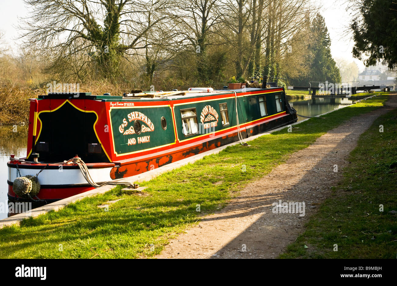 A narrowboat moored along the Kennet and Avon Canal at Hungerford Berkshire England UK with Hungerford Lock in the distance Stock Photo