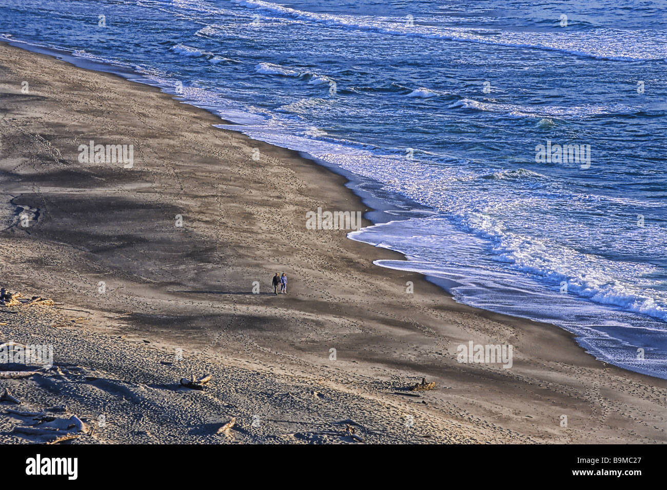 Couple walking on deserted beach Northern California USA Stock Photo