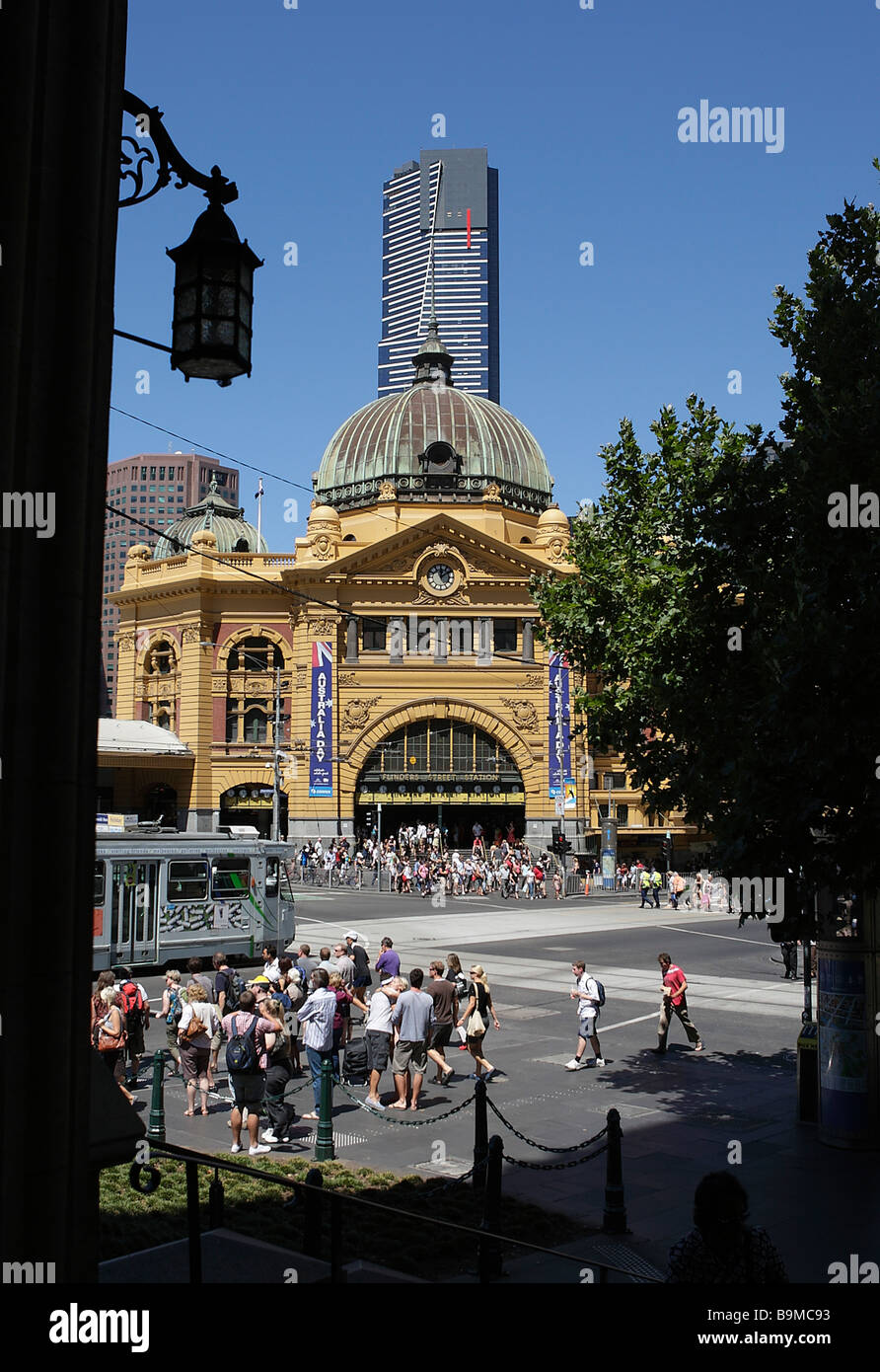 Historical Victorian train station Flinders Street station and Eureka Tower in the background in Melbourne,Australia. Stock Photo