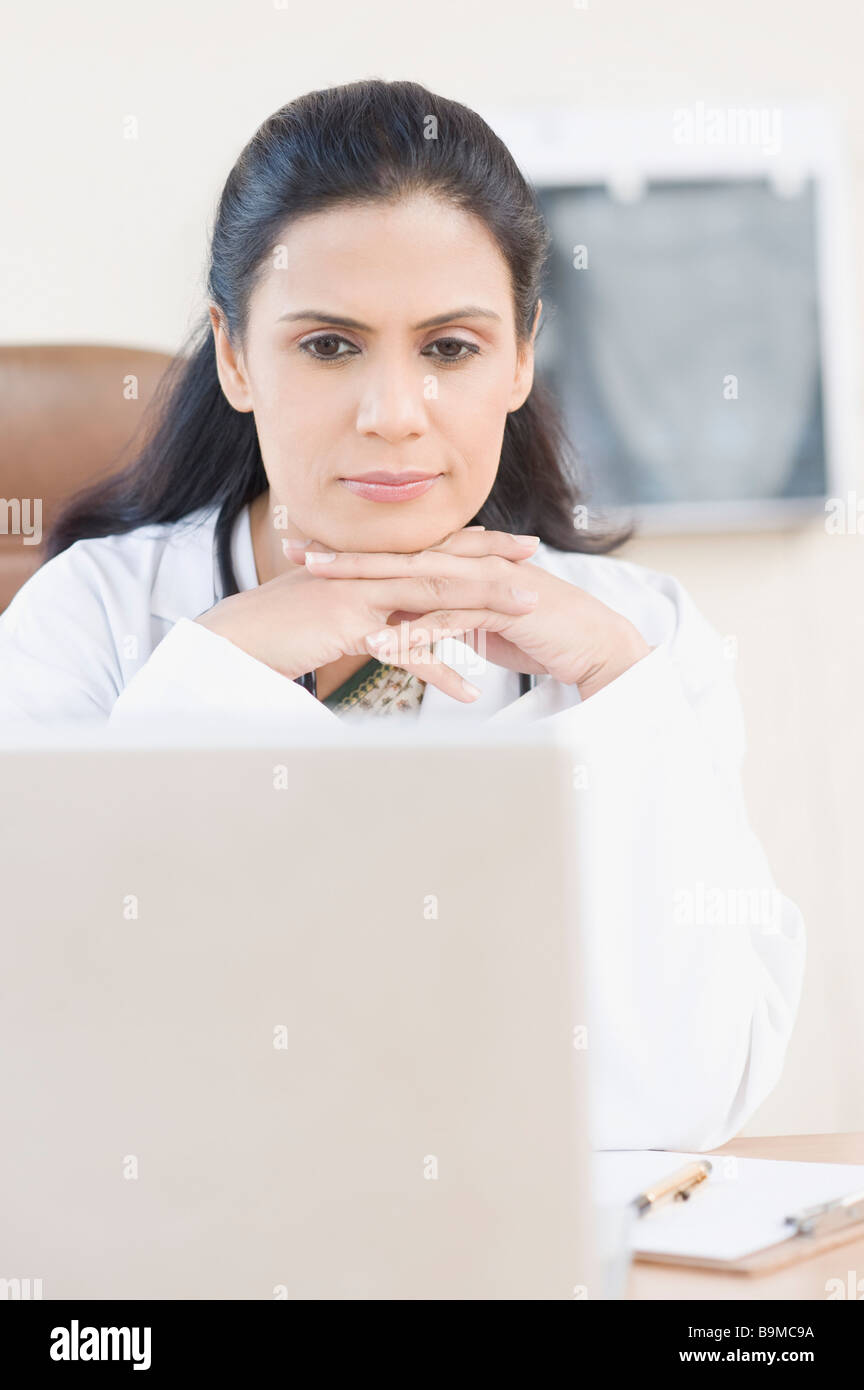 Female looking at laptop hi-res stock photography and images - Alamy