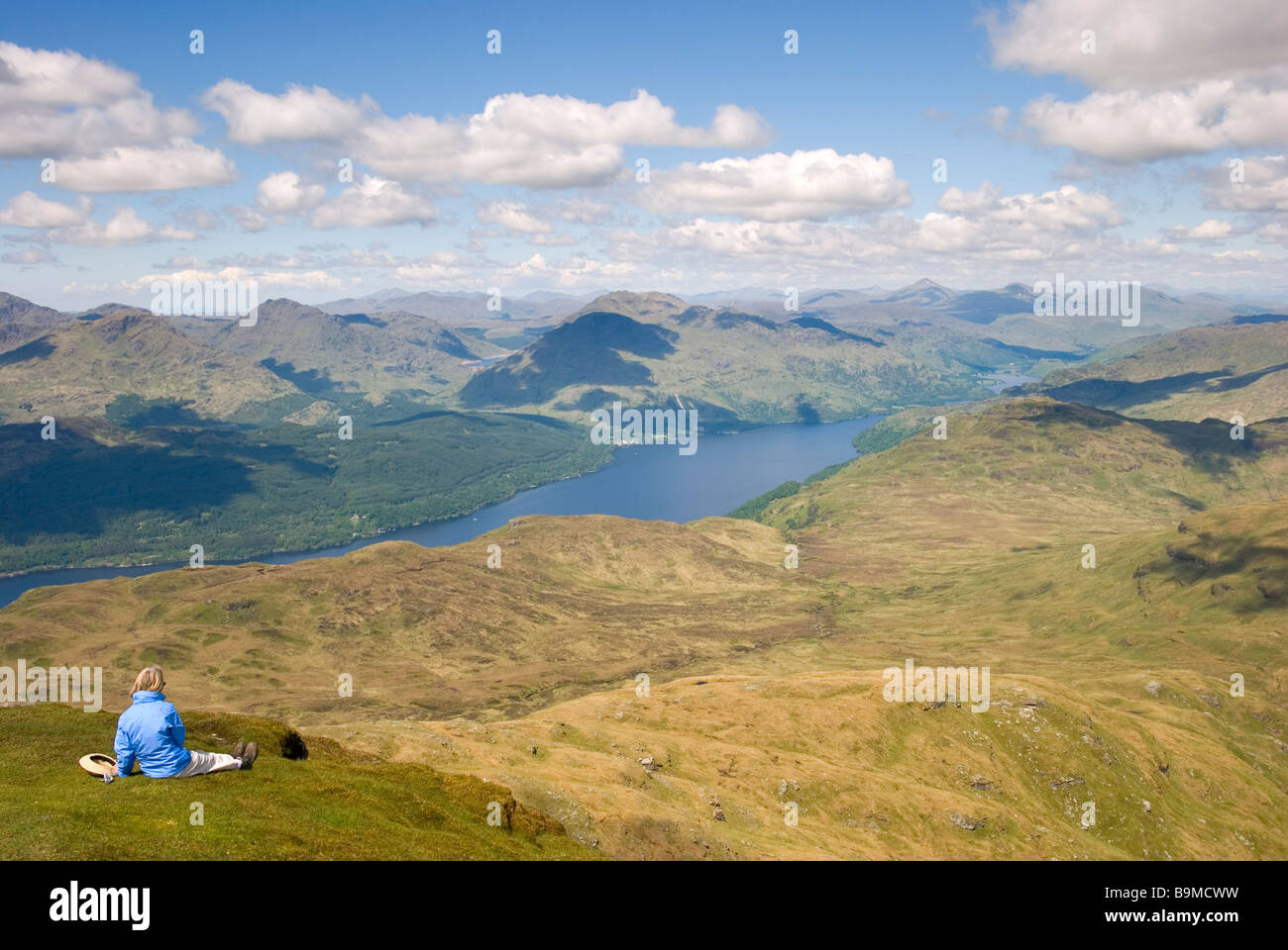 Woman Eating Her Lunch While Admiring The Stunning View From - 
