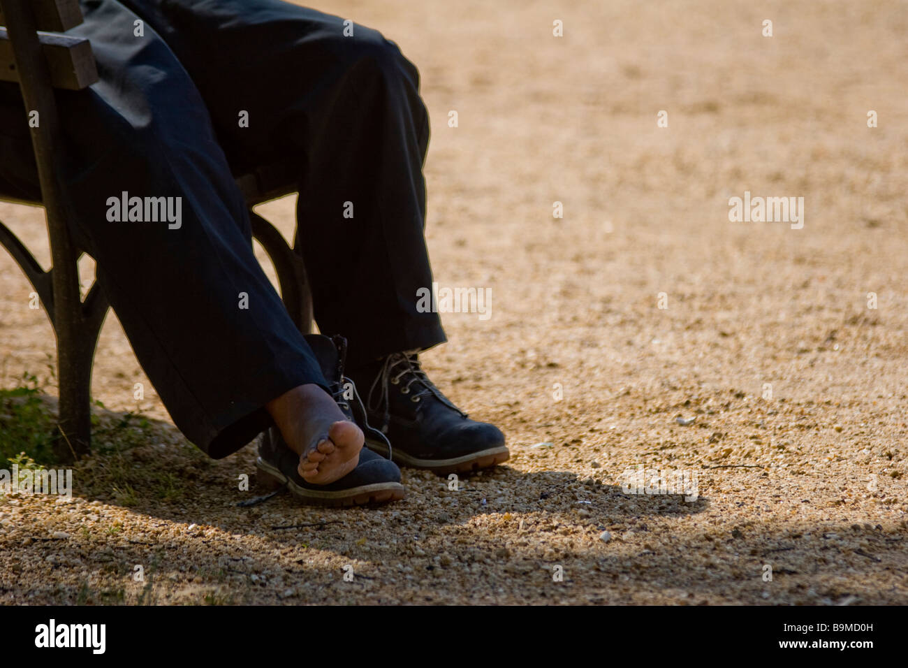 A homeless sits on a bench on the National Mall in Washington D C June 12 2006 Stock Photo