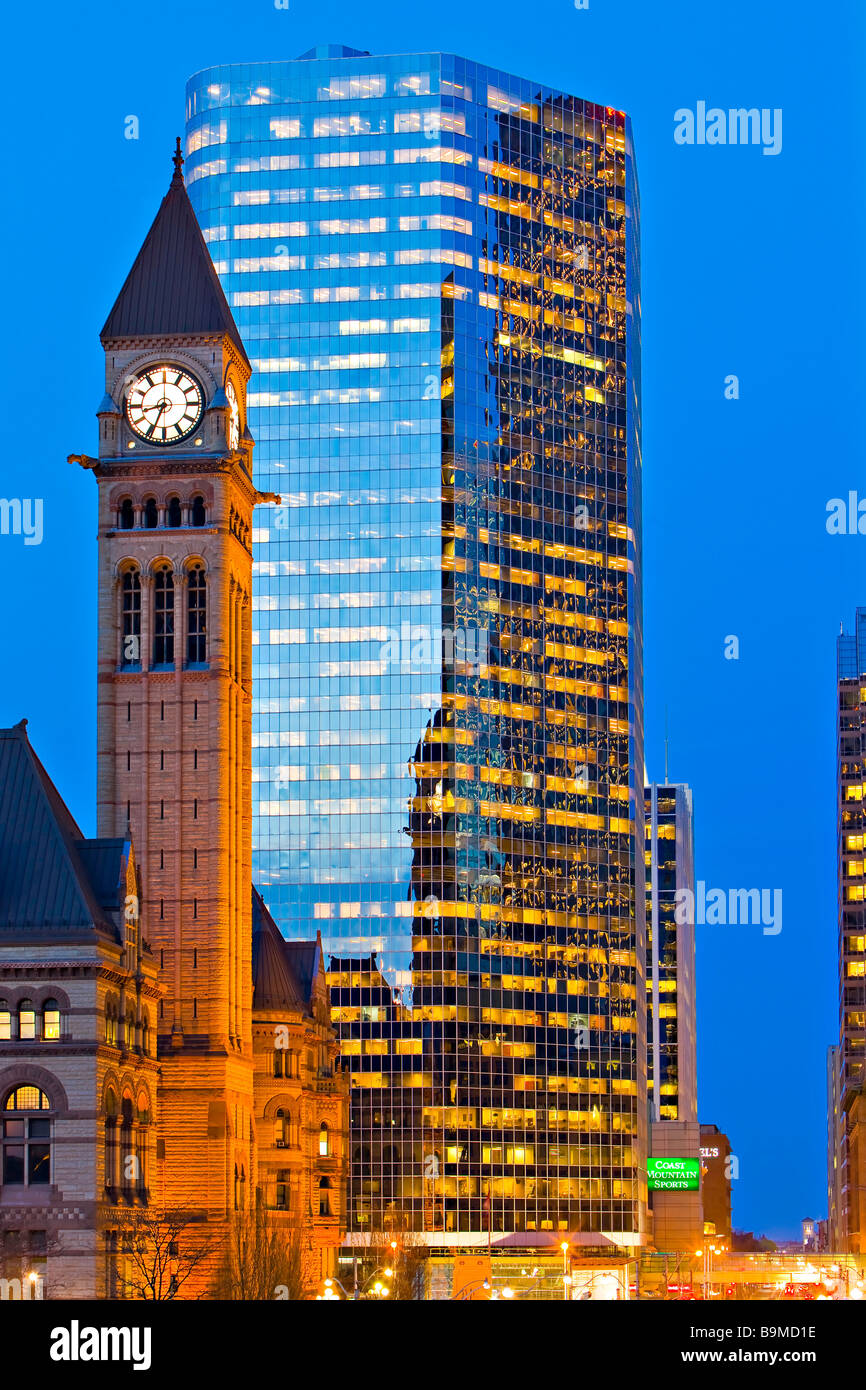 Clock Tower of the Old City Hall and a modern building in downtown