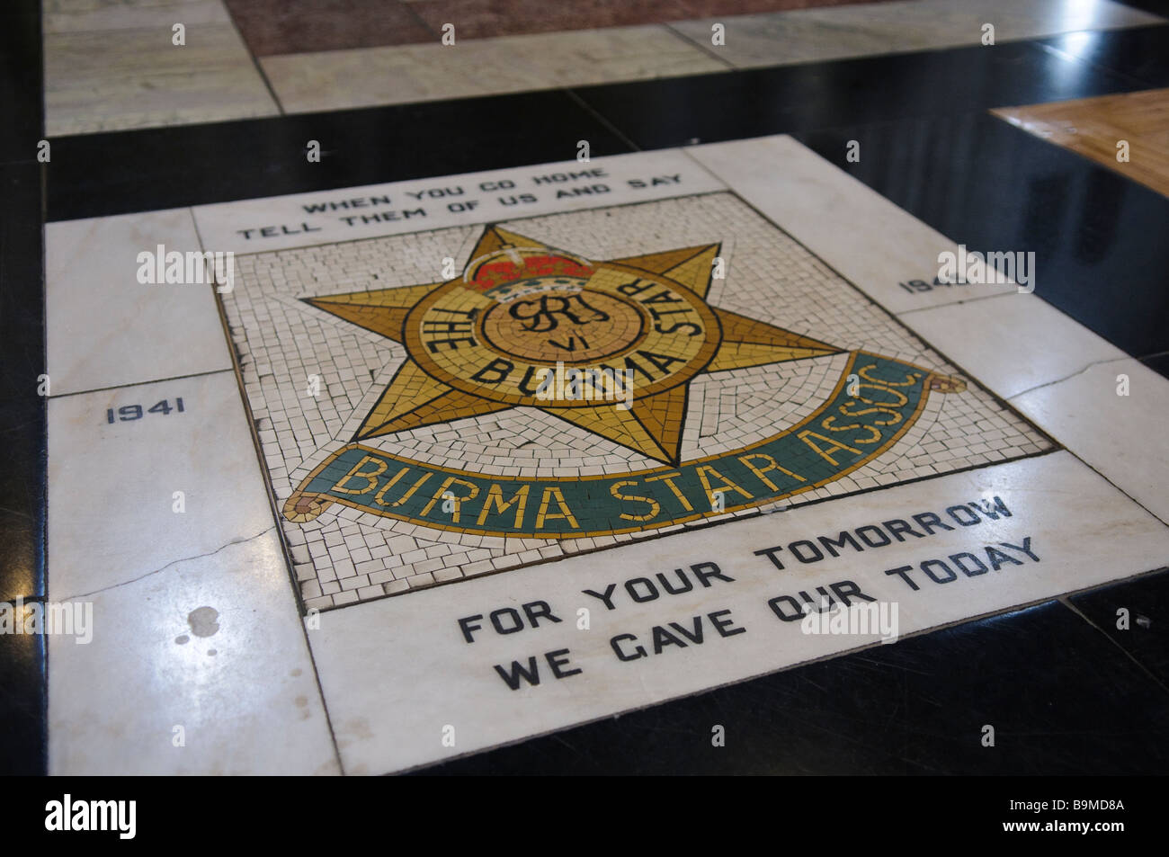 Insignia of the Burma Star regiment on the floor of St Anne's Cathedral, Belfast. Stock Photo