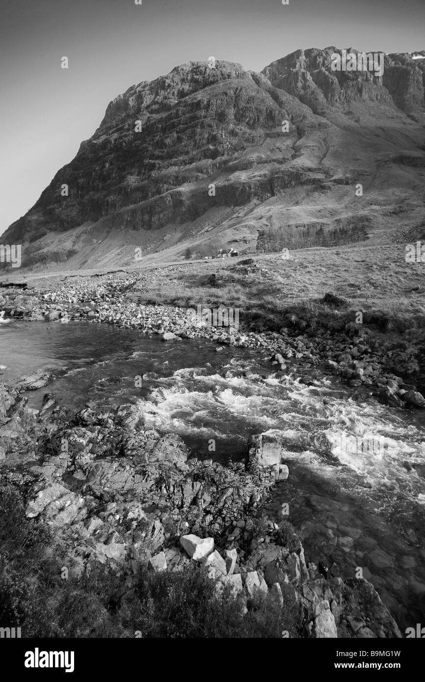 Black & white image mountainous scene ,snow melt stream, Scotland in portrait. Stock Photo
