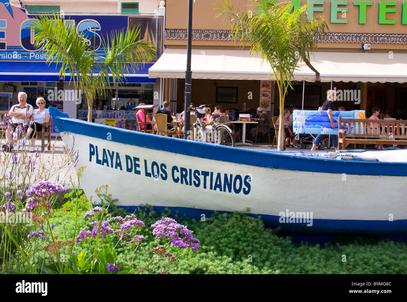 Feature traditional wooden fishing boat named 'Los Cristianos' lying on Los Cristianos beach Tenerife Canary Islands Spain Stock Photo