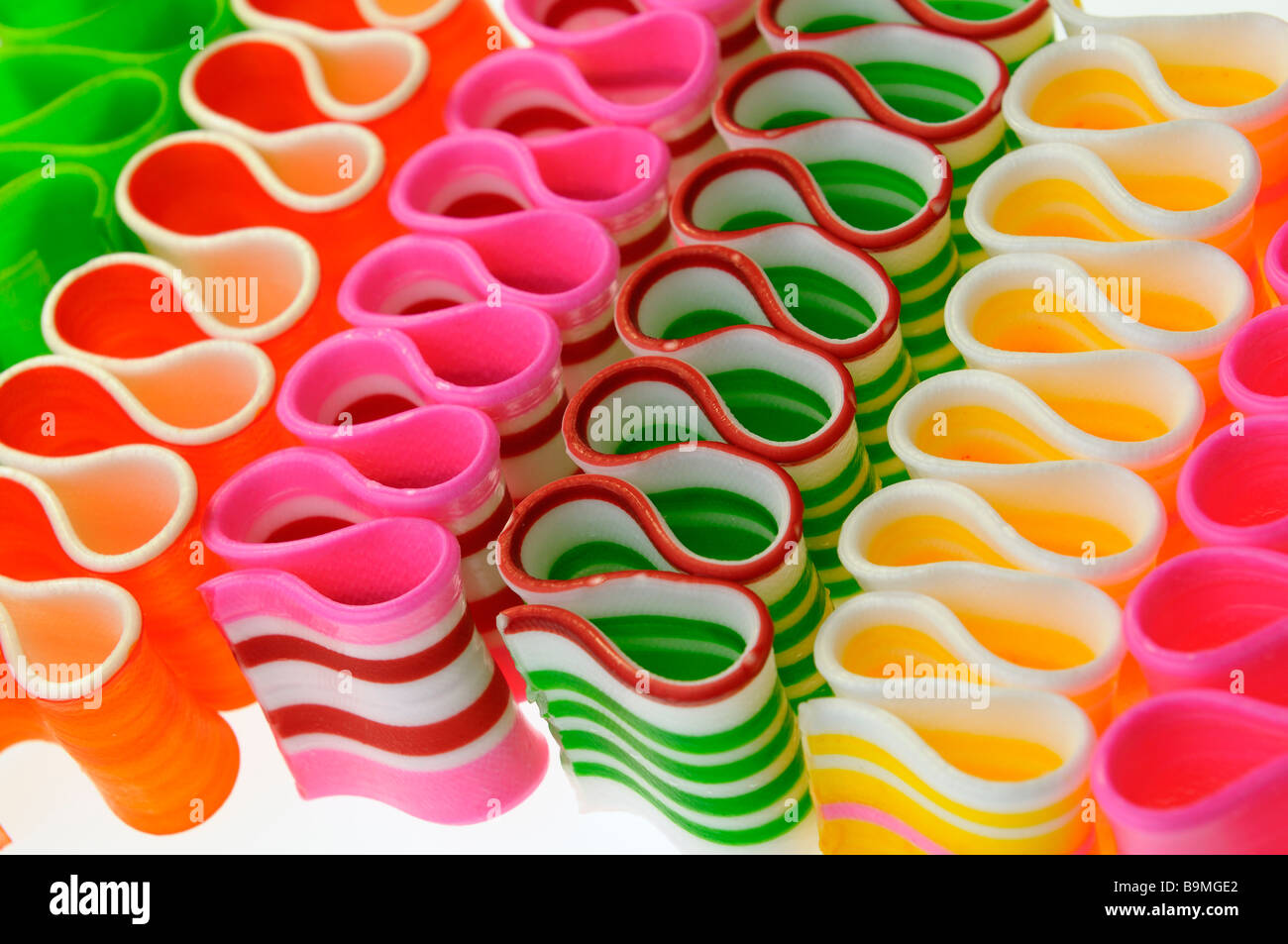 Diagonal strips of colorful thin strips of ribbon candy sweets Stock Photo