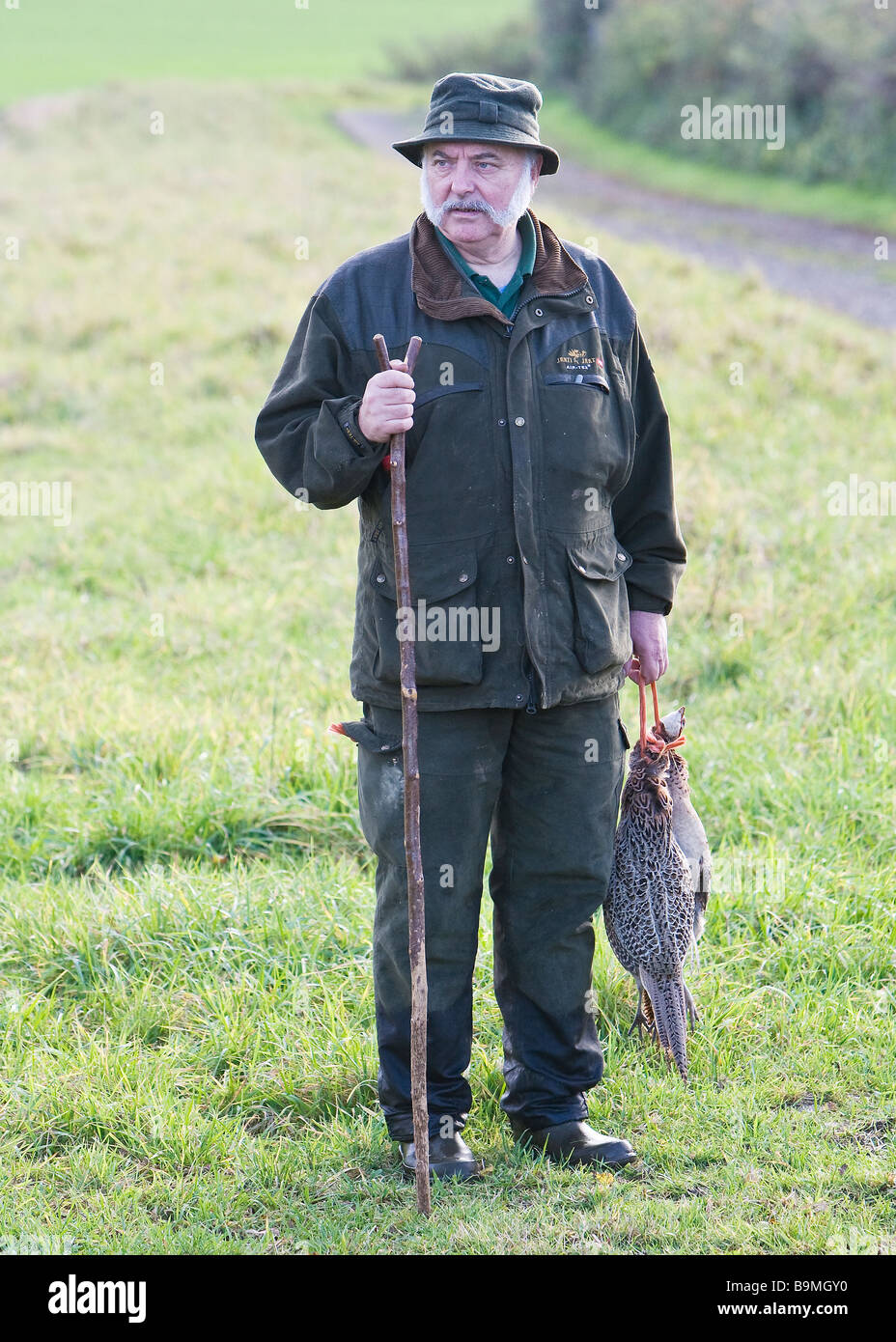 Beater Picker with Brace of Pheasant Stock Photo Alamy