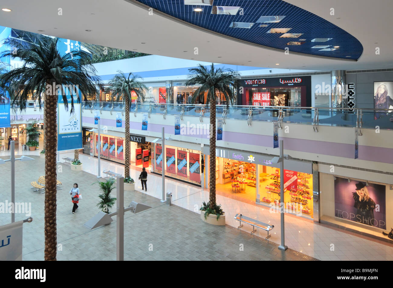 Abu Dhabi Marina shopping mall with stores on two levels including Next  fashion shop seen early morning Stock Photo - Alamy