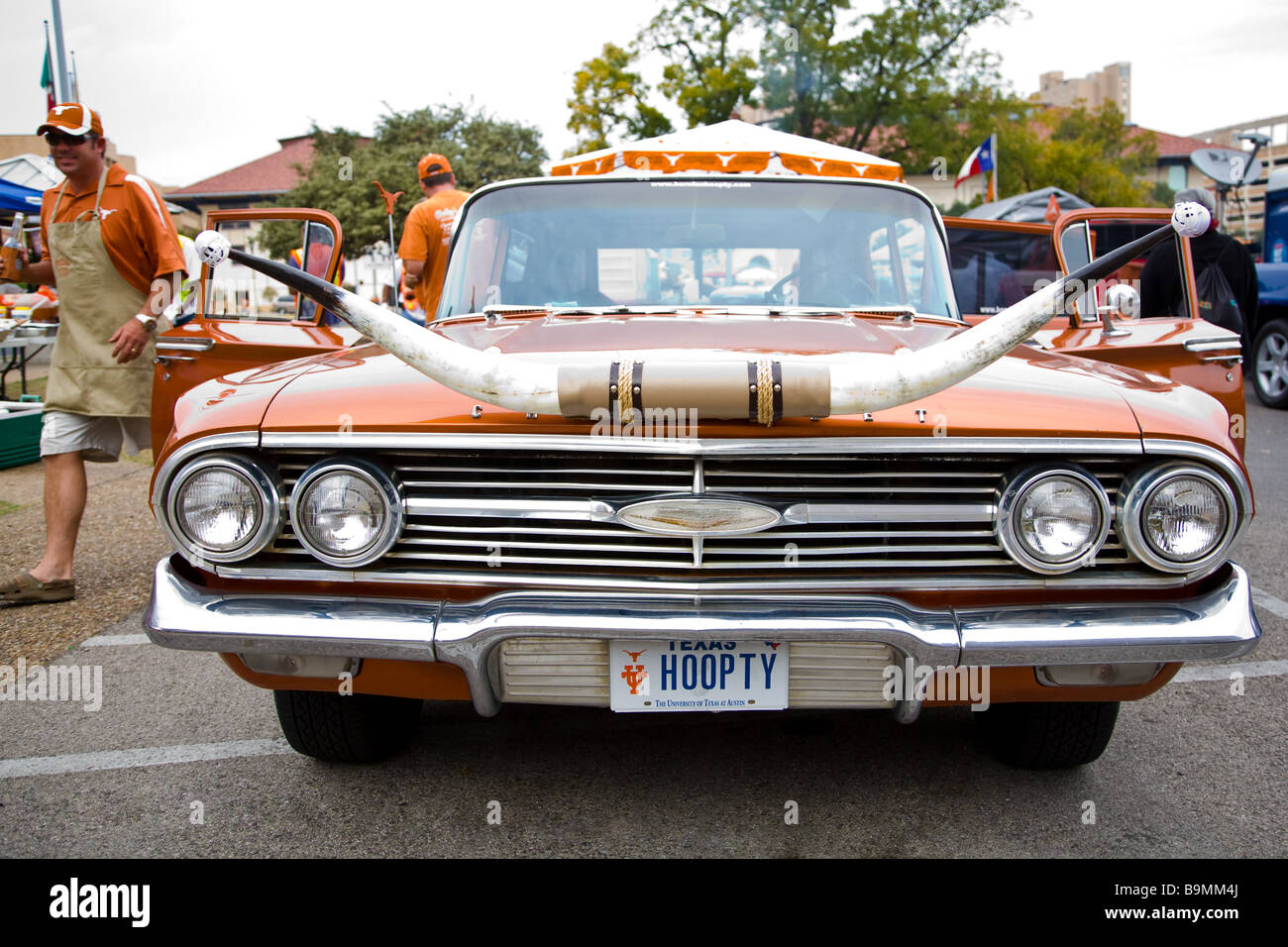 A burnt orange classic Longhorns car at a University of Texas pre-game tailgate Stock Photo
