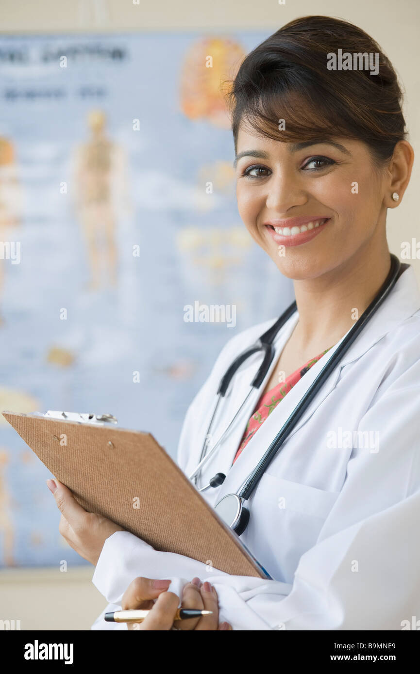 Female doctor holding a clipboard Stock Photo