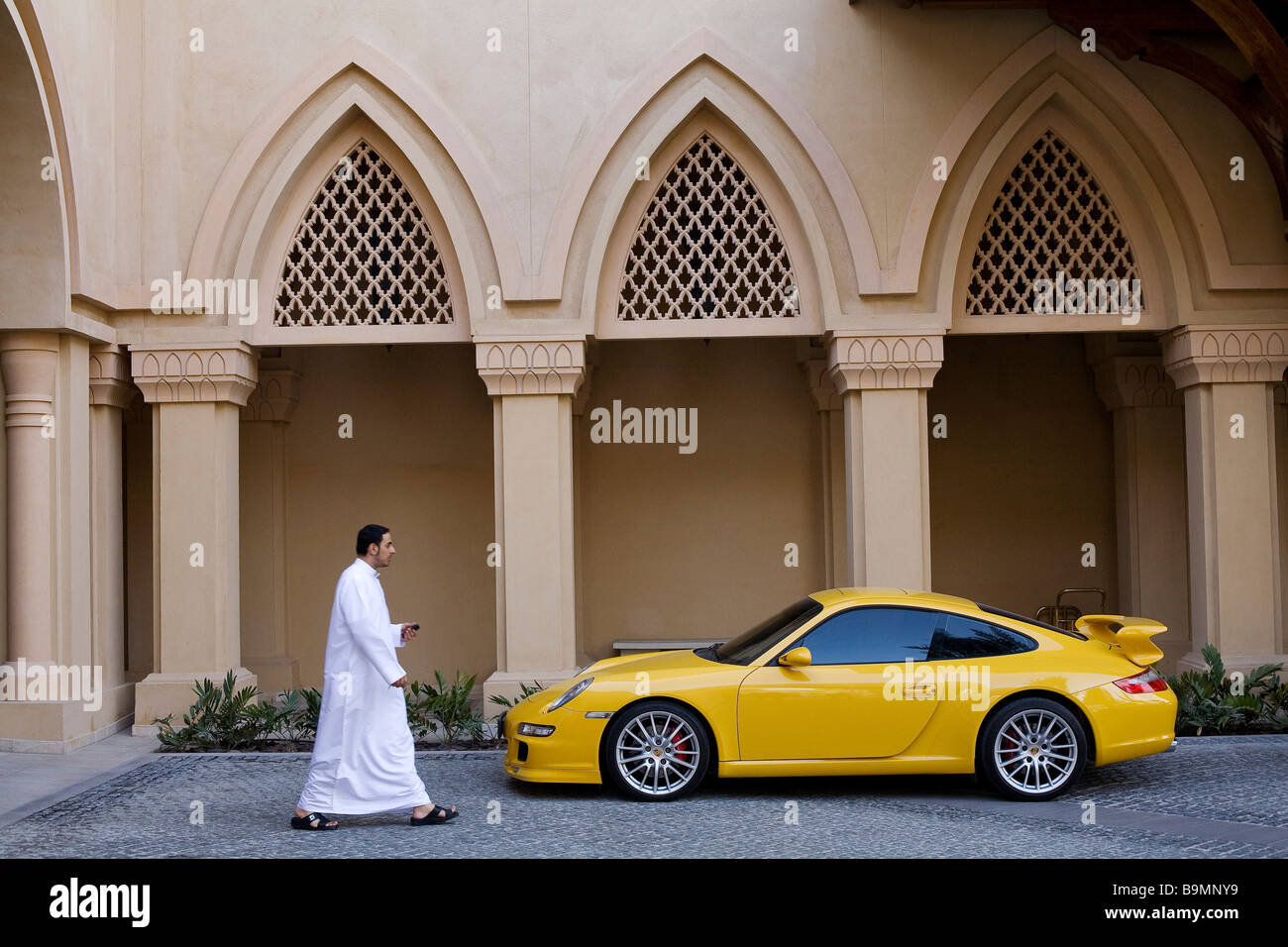 United Arab Emirates, Dubai, Downtown Burj Dubai, Sofitel The Palace The Old Town, principal entrance with a Porsche 911 Stock Photo