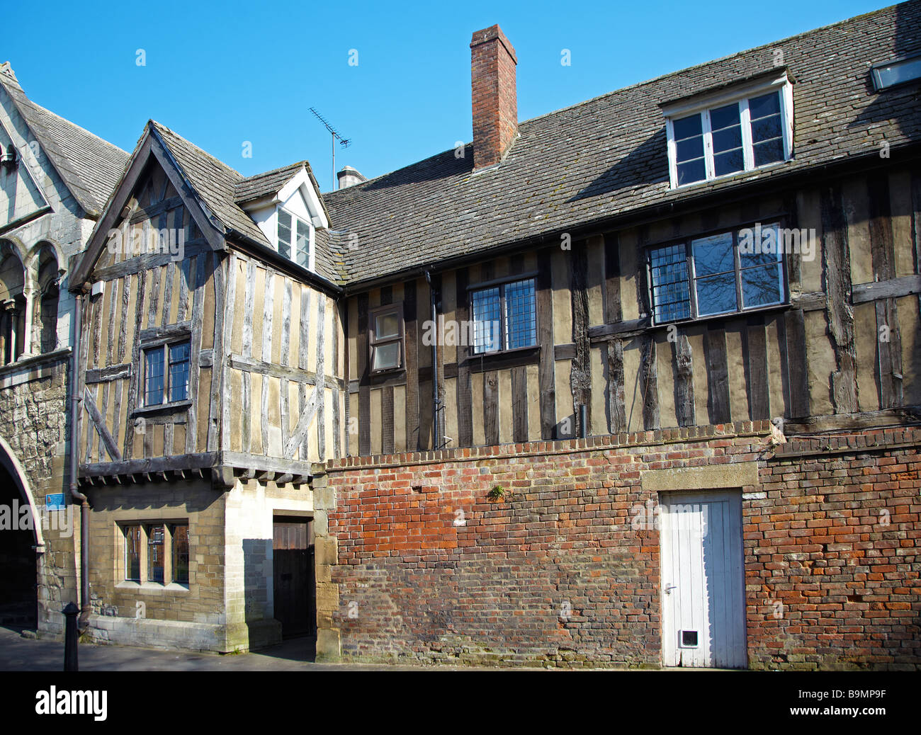 Half Timbered House, next to St. Mary's Gate, leading to Gloucester Cathedral. Gloucester, England, UK Stock Photo