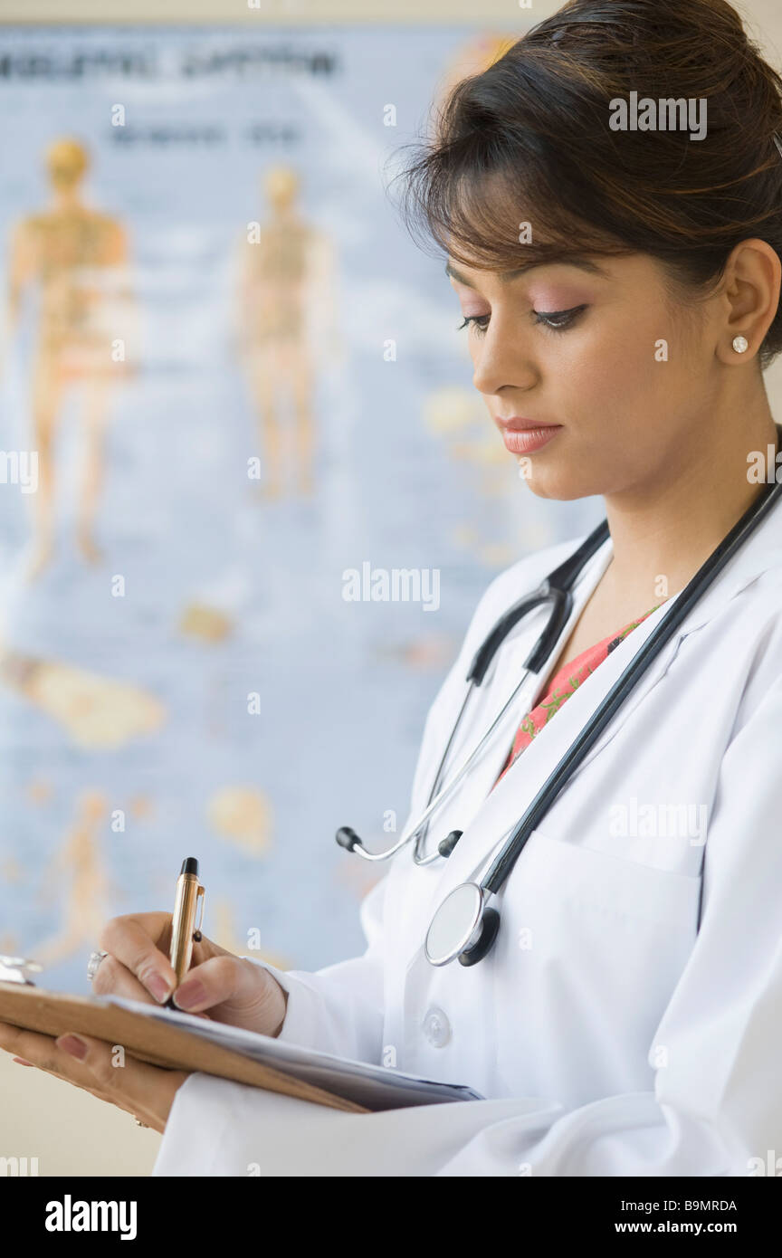 Female doctor writing a prescription Stock Photo - Alamy