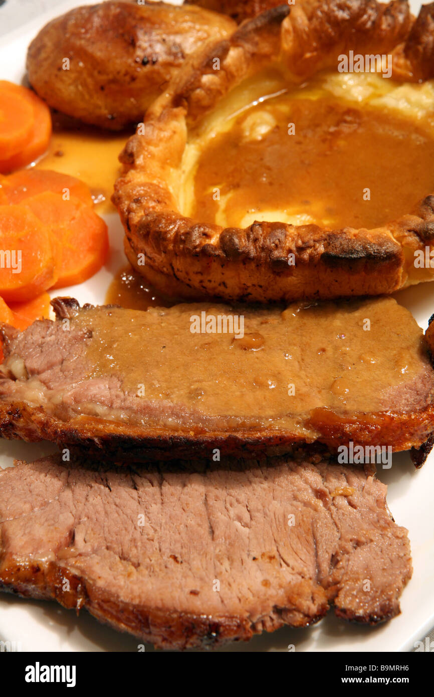 Extreme Close Up On A Traditional English Sunday Lunch Of Roast Beef And Yorkshire Pudding With